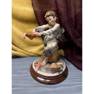 Giuseppe Armani 9" Figurine, “Boy Putting on Sock” – Florence Collection, Italy